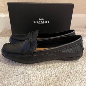 Coach black slip-on loafers. Soft leather. Size 7.5. Comfortable for daily wear.